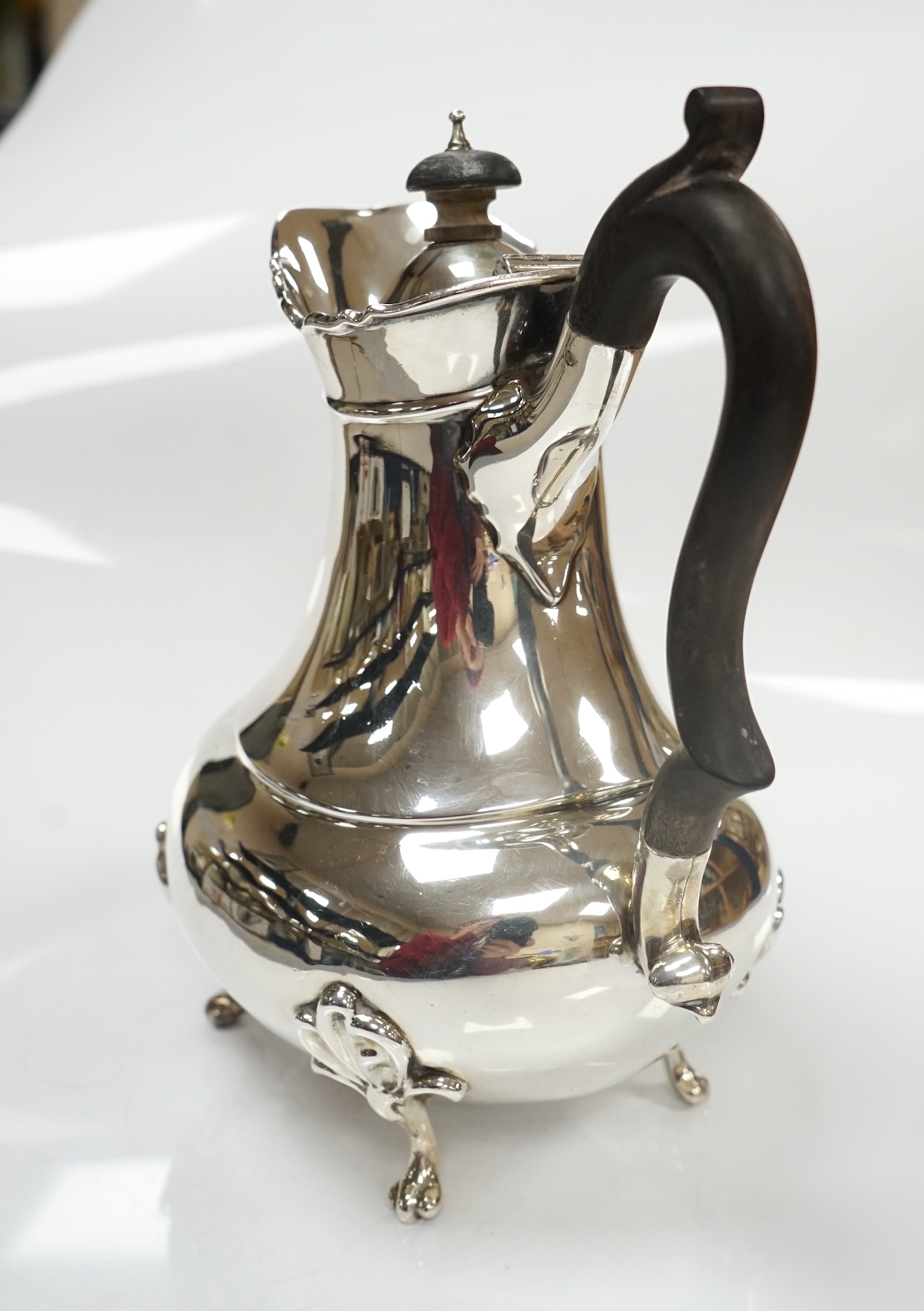 An Edwardian Scottish silver hot water pot, by Hamilton & Inches, Edinburgh, 1902, height 20.8cm, 20.9oz. Condition - fair to good